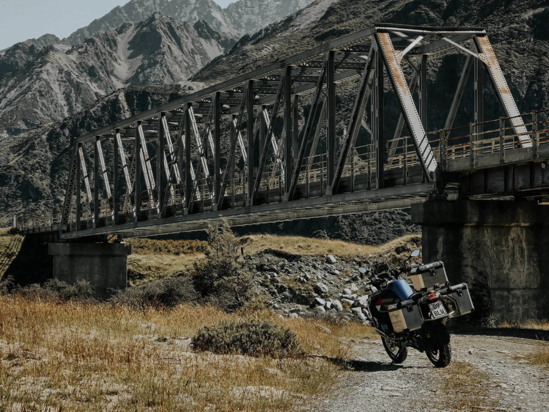 BMW R1250GSA on a trail alongside a rail bridge in New Zealand